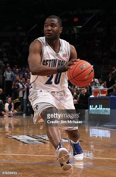 Eugene Harvey of the Seton Hall Pirates looks to pass against the Providence Friars during the first round game of the Big East Basketball Tournament...