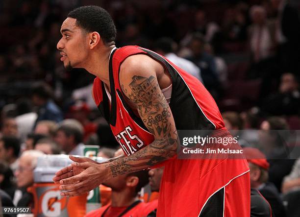 Mike Rosario of the Rutgers Scarlet Knights reacts from the bench against the Cincinnati Bearcats during the first round game of the Big East...