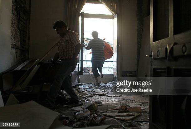 Workers salvage what they can from a home that was damaged during the February 27th earthquake March 10, 2010 in Concepcion, Chile. Food, water and...