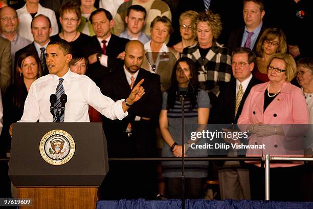 President Barack Obama rallies support for his health care reform initiative as Sen. Claire McCaskill looks on at St. Charles High School on March...