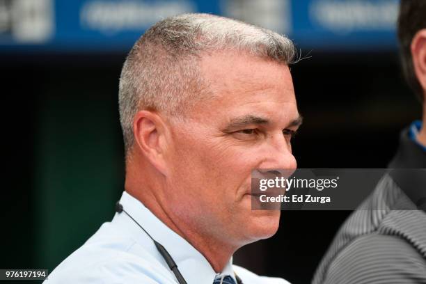 Dayton Moore general manager of the Kansas City Royals watches the batting practice prior to a game against the Cincinnati Reds at Kauffman Stadium...