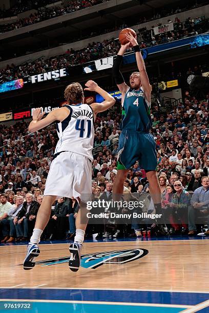 Oleksiy Pecherov of the Minnesota Timberwolves shoots over Dirk Nowitzki of the Dallas Mavericks during the game on March 3, 2010 at American...