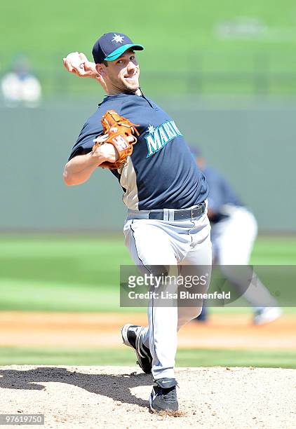 Cliff Lee of the Seattle Mariners pitches during a spring training game against of the Texas Rangers on March 10, 2010 at Surprise Stadium in...