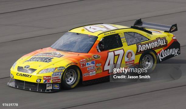 Marcos Ambrose, driver of the Armor All Toyota drives during practice for the NASCAR Sprint Cup Series Auto Club 500 at Auto Club Speedway on...