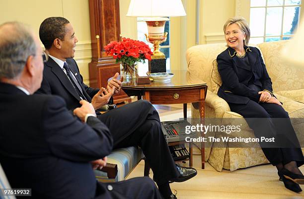 President Obama meets with Secretary of State Hillary Clinton, George Mitchell, and Vice President Joe Biden in the Oval office. Pictured, L-R:...