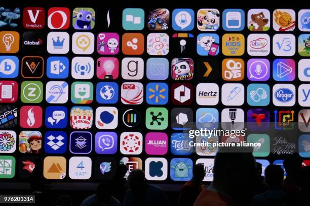 June 2018, San Jose, USA: Developers standing before a large screen in the McEnery Convention Center during the Apple Developer Conference WWDC 2018...
