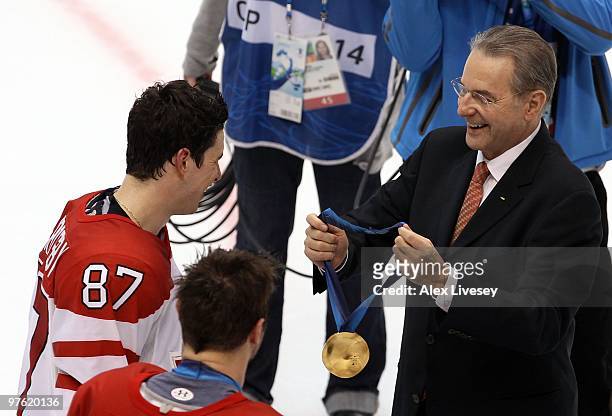 Sidney Crosby of Canada smiles prior to being presented his gold medal by IOC President Jacques Rogge following his team's 3-2 overtime win in the...