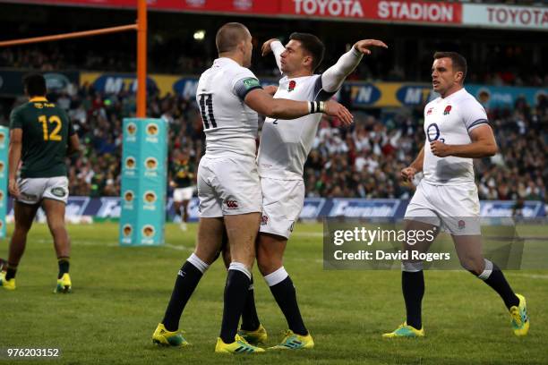 Mike Brown of England celebrates with team mate Ben Youngs after he scores the opening try of the match during the second test match between South...