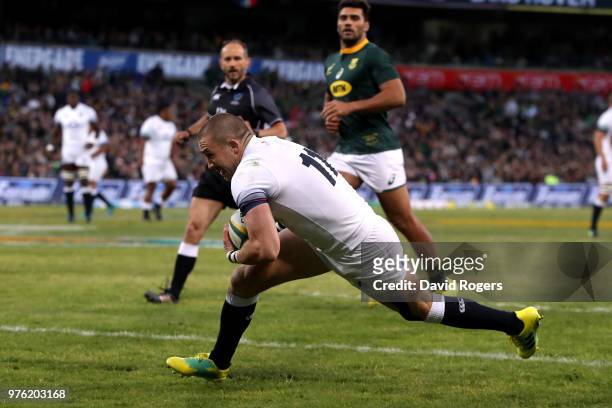 Mike Brown of England dives over to score the opening try during the second test match between South Africa and England on June 16, 2018 in...