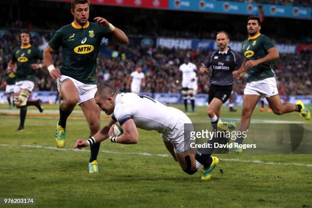 Mike Brown of England dives over to score the opening try during the second test match between South Africa and England on June 16, 2018 in...