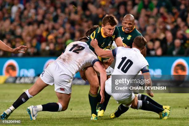 South Africas fly-half Handre Pollard is tackled during the second test match South Africa vs England at the Free State Stadium in Bloemfontein, on...