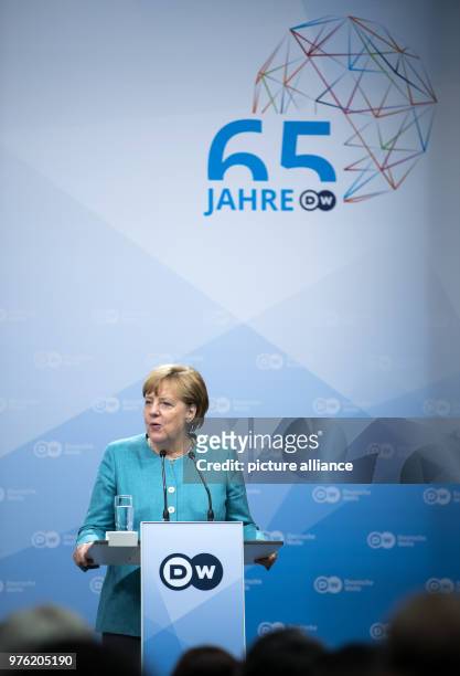 June 2018, Germany, Berlin: German Chancellor Angela Merkel of the Christian Democratic Union delivers a speech during the ceremony '65 Jahre...