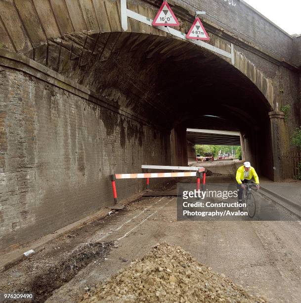 Road about to be resurfaced under railway overbridge, A4251 Hemel Hempstead to Berkhamsted road refurbishment scheme, Hertfordshire, United Kingdom,.