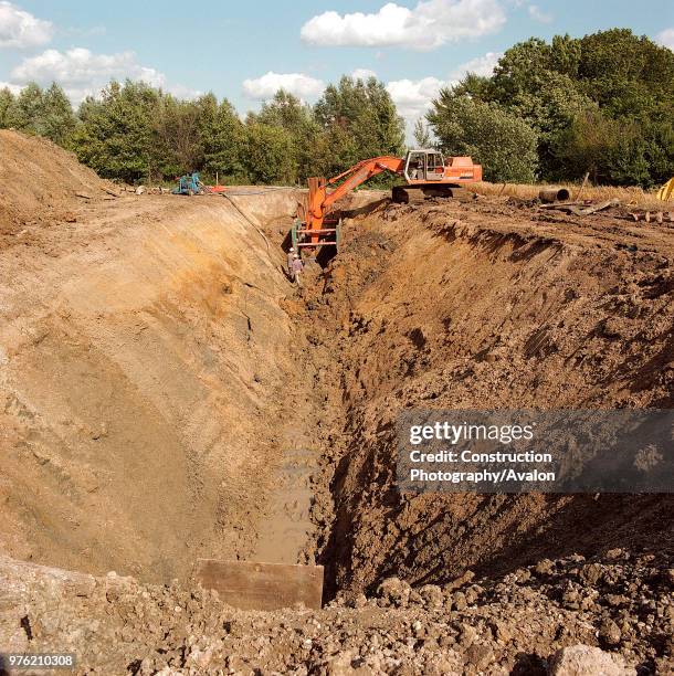 Backhoe Trenches 391 Backhoe Digging Trench Stock Photos, High-Res Pictures, and Images ...