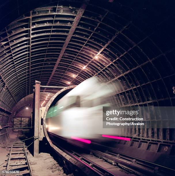 London Underground train entering tunnel during refurbishment of Angel Underground station, London, United Kingdom,.