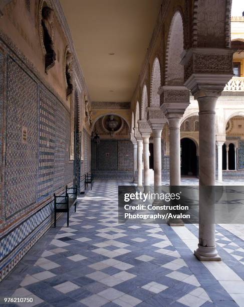 Hallway with courtyard and pillars, casa de pilatos, seville, Spain.