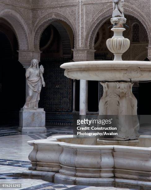 Fountain and statue in a courtyard, casa de pilatos, seville, Spain.