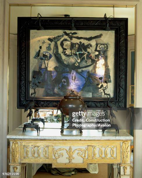 An ornate painting adorned the wall of a house.