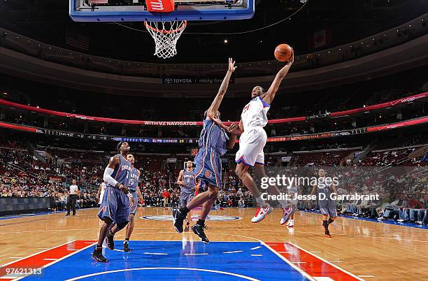 Thaddeus Young of the Philadelphia 76ers shoots against Tyrus Thomas of the Charlotte Bobcats during the game on March 10, 2010 at the Wachovia...