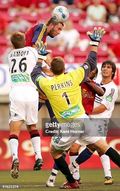 Jack Stewart of Real Salt Lake heads ball against Bryan Namoff and goal keeper Troy Perkins DC United during their match on Saturday, July 29, 2006...