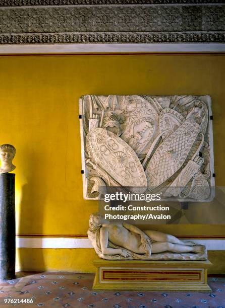 Wall art mounted on wall with naked statue, casa de pilatos, Seville, Spain.