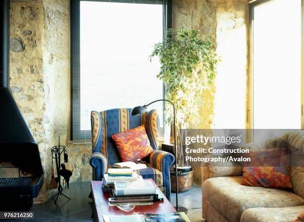 View of a an armchair against a coffee table.