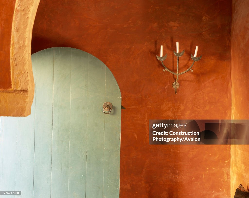 View of a door and candle stand in a traditional house