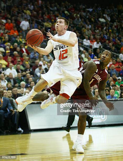 Guard Keiton Page of the Oklahoma State Cowboys makes a layup in a game against the Oklahoma Sooners at the Sprint Center on March 10, 2010 in Kansas...