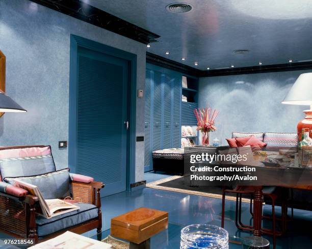 View of a living room adjoined with a dining room.