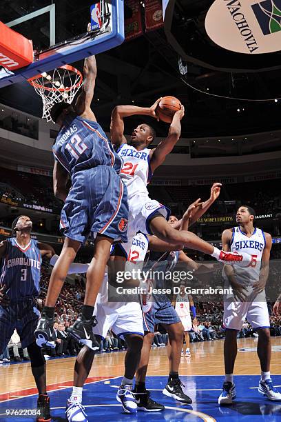 Thaddeus Young of the Philadelphia 76ers shoots against Tyrus Thomas of the Charlotte Bobcats during the game on March 10, 2010 at the Wachovia...