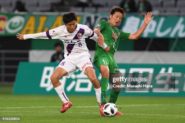 Takuya Shigehiro of Kyoto Sanga and Ryohei Hayashi of Tokyo Verdy compete for the ball during the J.League J2 match between Tokyo Verdy and Kyoto...