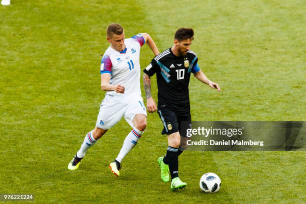 Alfred Finnbogason of Iceland and Lionel Messi of Argentina battle for the ball during the 2018 FIFA World Cup Russia group D match between Argentina...