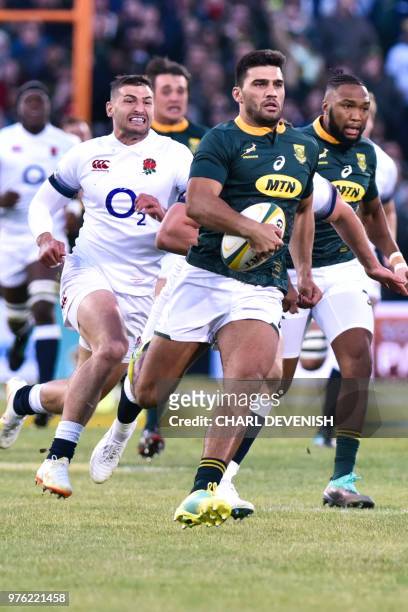 South Africas centre Damian de Allende runs with the ball during the second test match South Africa vs England at the Free State Stadium in...