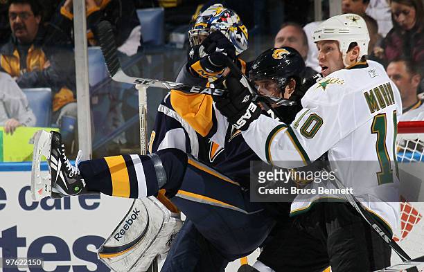 Andrej Sekera of the Buffalo Sabres is hit by Brenden Morrow of the Dallas Stars at the HSBC Arena on March 10, 2010 in Buffalo, New York. The Sabres...