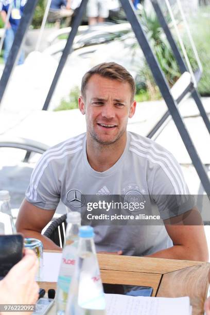 June 2018, Italy, Eppan: Soccer, National Team of Germany, Media Day, Training Camp for World Cup 2018 Preparation. Goal Keeper Manuel Neuer gives...