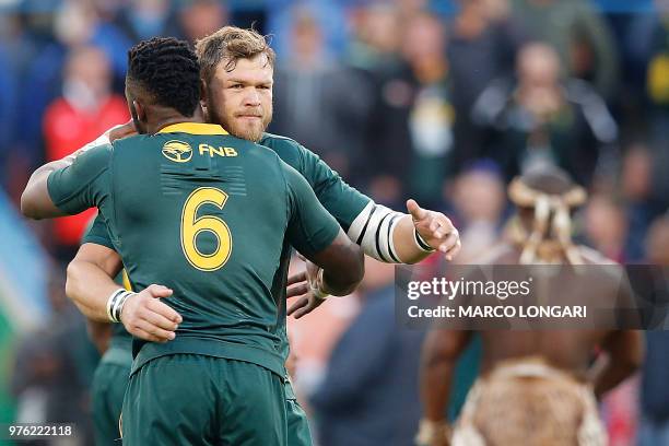 South Africa flanker and captain Siya Kolisi hugs South Africa's hooker Akker van der Merwe at the beginning of the second test match South Africa vs...