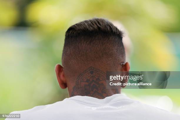 June 2018, Italy, Eppan: Soccer, National Team of Germany, Media Day, Training Camp for World Cup 2018 Preparation. Jerome Boateng gives the...