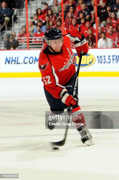 Mike Green of the Washington Capitals shoots the puck against the Carolina Hurricanes on March 10, 2010 at the Verizon Center in Washington, DC.