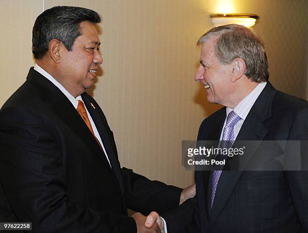Indonesian President Susilo Bambang Yudhoyono greets Australia's Trade Minister Simon Crean during a meeting with business leaders prior to attending...