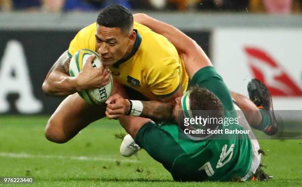 Israel Folau of the Wallabies is tackled by Rob Herring of Ireland during the International test match between the Australian Wallabies and Ireland...