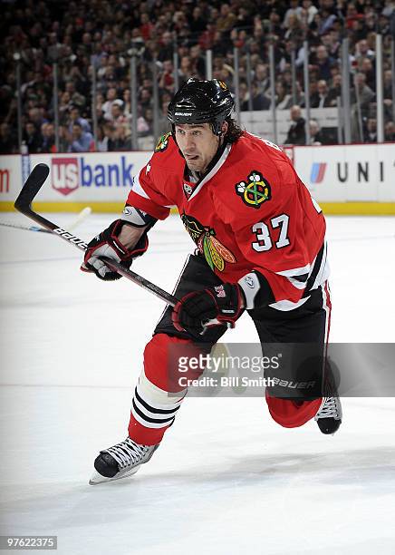 Adam Burish of the Chicago Blackhawks skates toward the puck during a game against the Los Angeles Kings on March 10, 2010 at the United Center in...