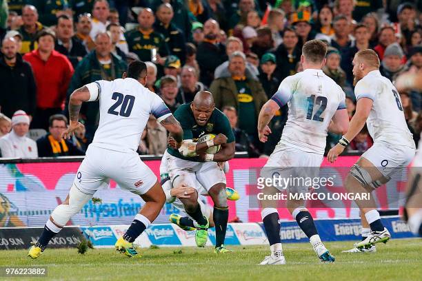 South Africa's hooker Bongi Mbonambi challenges England's flanker Nathan Hughes during the second test match South Africa vs England at the Free...