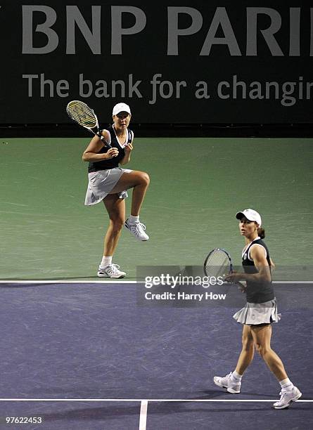 Liezel Huber of the United States and Cara Black of Zimbabwe react in their match against Shahar Pe'er of Israel and Sara Errani of Italy during the...