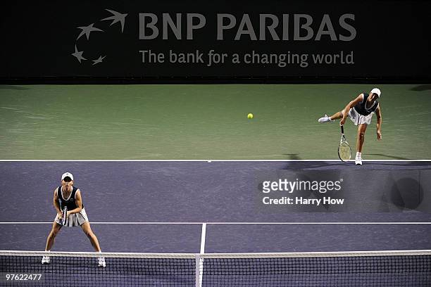 Liezel Huber of the United States and Cara Black of Zimbabwe serve in their match against Shahar Pe'er of Israel and Sara Errani of Italy during the...