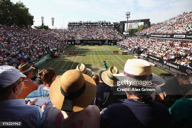 Roger Federer of Switzerland serves the ball to Nick Kyrgios of Australia during day 6 of the Mercedes Cup at Tennisclub Weissenhof on June 16, 2018...