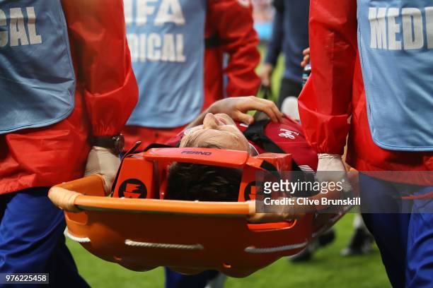 William Kvist of Denmark is carried off the pitch on a stretcher during the 2018 FIFA World Cup Russia group C match between Peru and Denmark at...