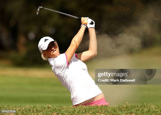 Melissa Reid of England hits out of a bunker on the 13th hole during round one of the 2010 Women's Australian Open at The Commonwealth Golf Club on...