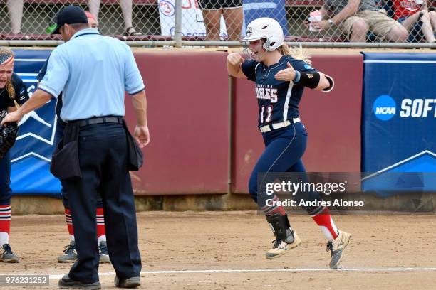 Claire Johnson of St. Anselm College celebrates a home run against the University of Southern Indiana during the Division II Women's Softball...