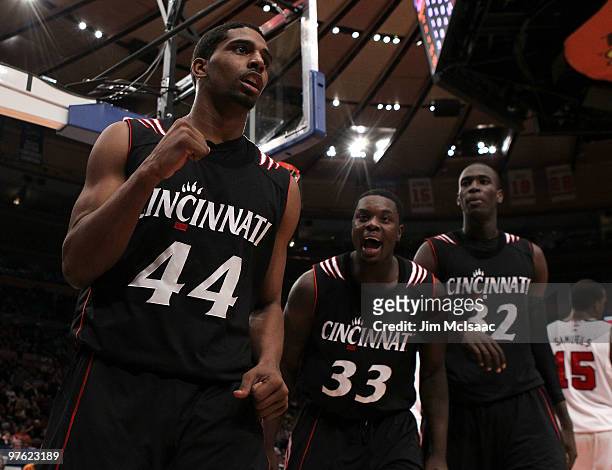 Jaquon Parker, Lance Stephenson and Ibrahima Thomas of the Cincinnati Bearcats celebrates after a play in the second half against the Louisville...