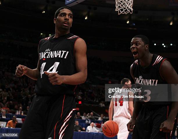 Jaquon Parker and Lance Stephenson of the Cincinnati Bearcats celebrates after a play in the second half against the Louisville Cardinals during the...